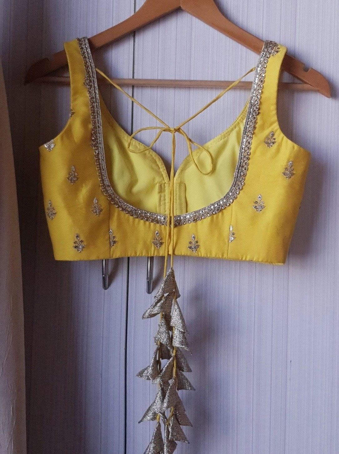 Mustard Yellow Embroidered Sleeveless Blouse with Deep Neck & Tassel Tie-Up Back